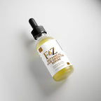 Applying Fapzlee Botanical Hair Growth Serum to scalp